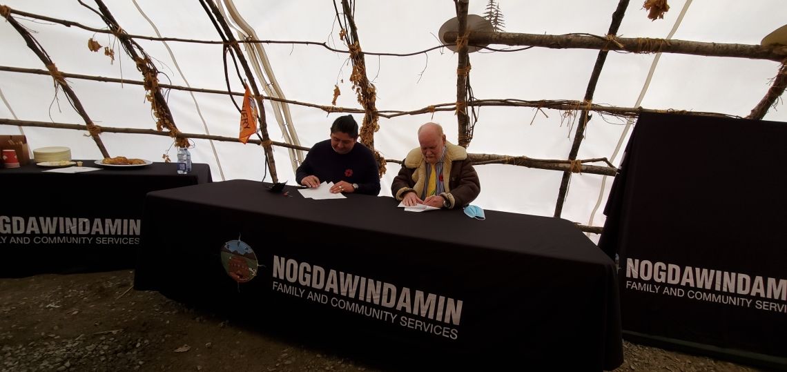 “CEO Kerry Francis, President Dr. Ron Common signing Collaboration Agreement at Garden River First Nation Teaching Lodge."